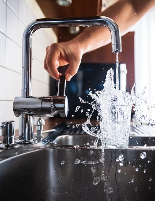 person opening faucet